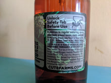 Load image into Gallery viewer, instructions for plant food spray bottle saying to unlock safety tab before use, use with regular watering. Shows how to use, ingredients, and warning to keep away from children and animals and to wash hands.