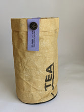 Load image into Gallery viewer, Lavender grow kit in a recycled bag that is tan and shows the printing from what was originally in it. Thsi kit contains the soil and organic seeds to grow the lavender right in the little bag that fits easily onto your window sill.