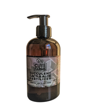 Cargar imagen en el visor de la galería, Amber colored 8 ounce pump bottle of succulent cacti and aloe plant fertilizer for monthly use