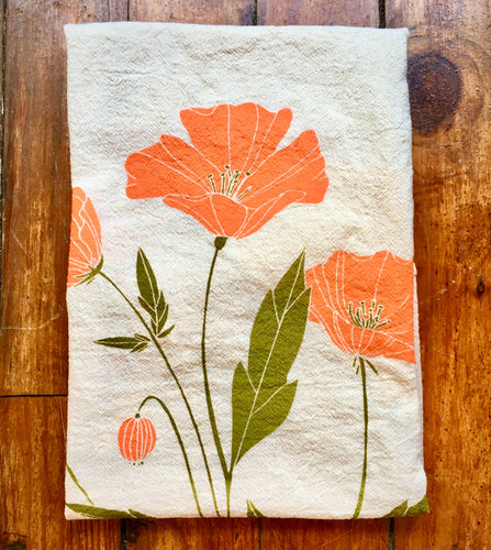 Poppy flower in retro orange and green screen printed onto unbleached cotton tea towel 